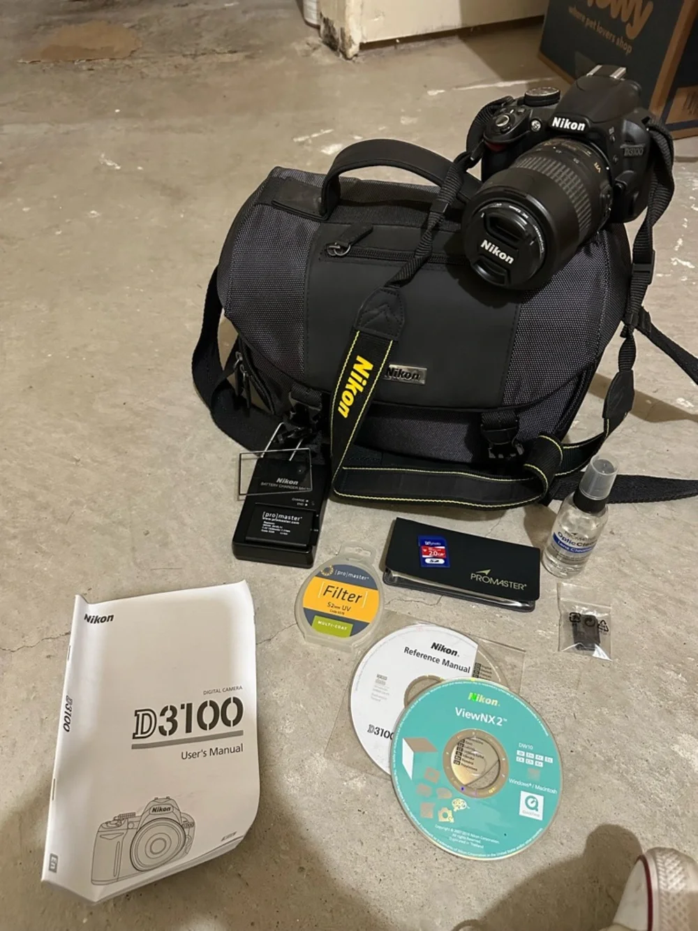 Nikon D3100 DSLR Camera Kit in Black and Yellow-Accented Strap